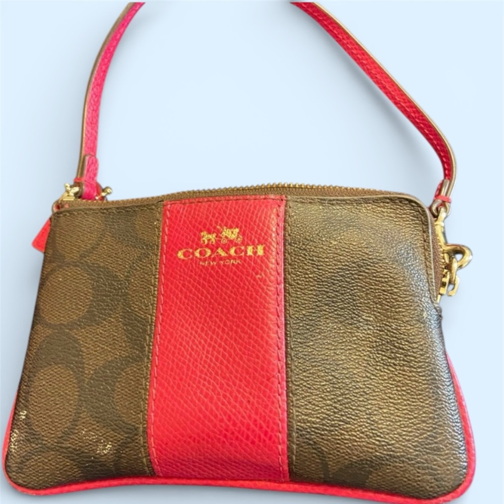 Best Price! Coach! A pink and dark brown Wristlet